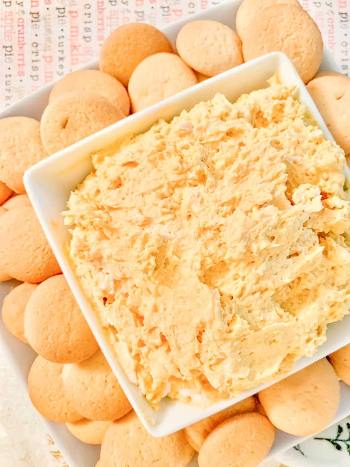 Easy pumpkin dip with cool whip served with vanilla cookies