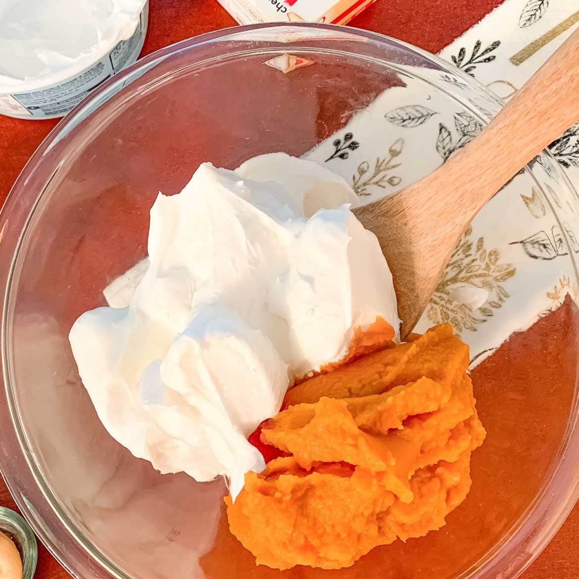 pumpkin puree and Cool whip in bowl for Easy Pumpkin Fluff Dip with Cool Whip with Only 3 Ingredients
