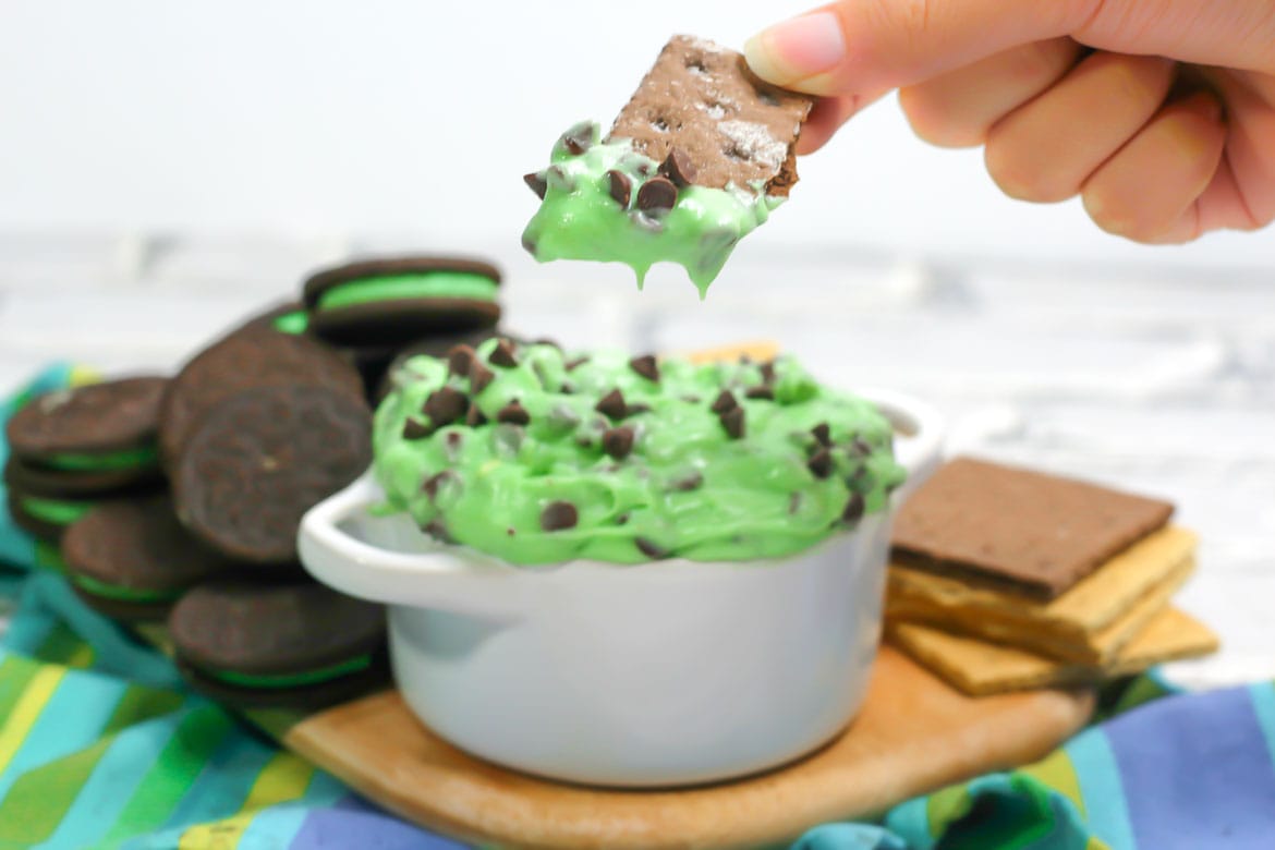 mint chocolate chip cheesecake dip served with graham crackers and mint Oreos
