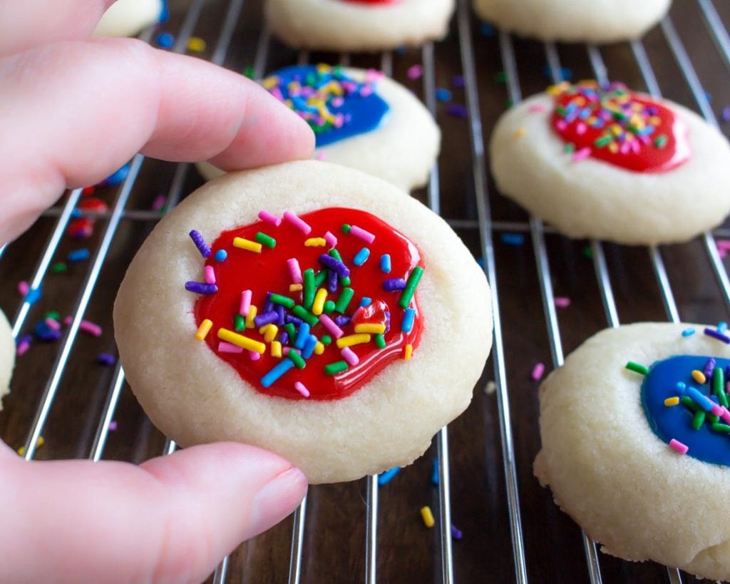 thumbprint cookies with icing and sprinkles