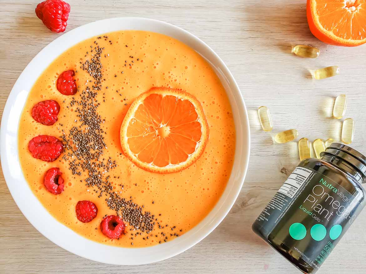 Sunshine smoothie bowl with NutraVege Omega 3 liquid gels