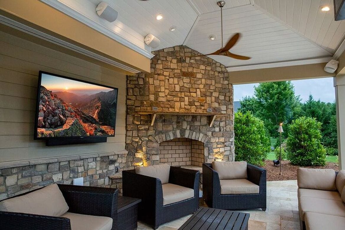 SunBrite outdoor TV on a patio with fireplace