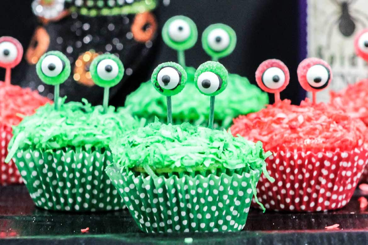 red and green alien cupcakes with eyes on a stalk