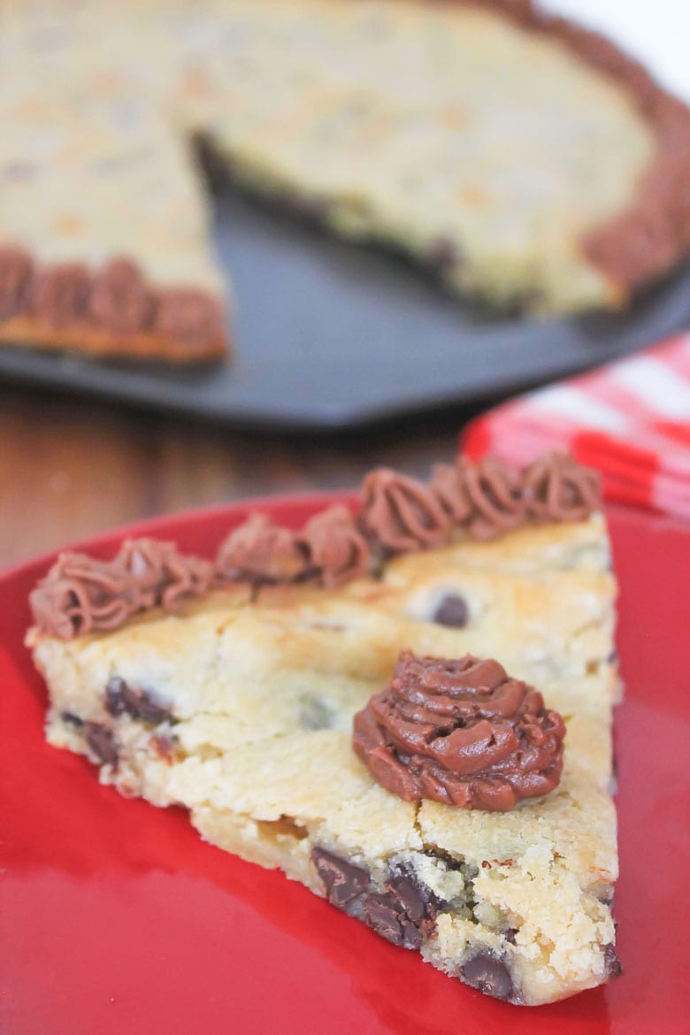 giant chocolate chip cookie cake with chocolate icing