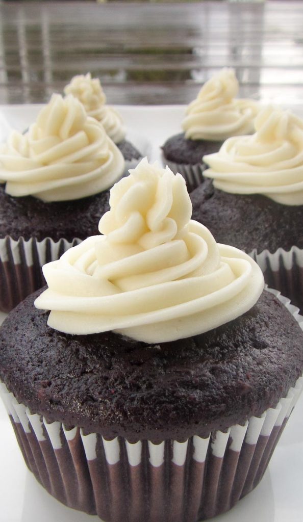 old fashioned buttercream icing on chocolate cupcake