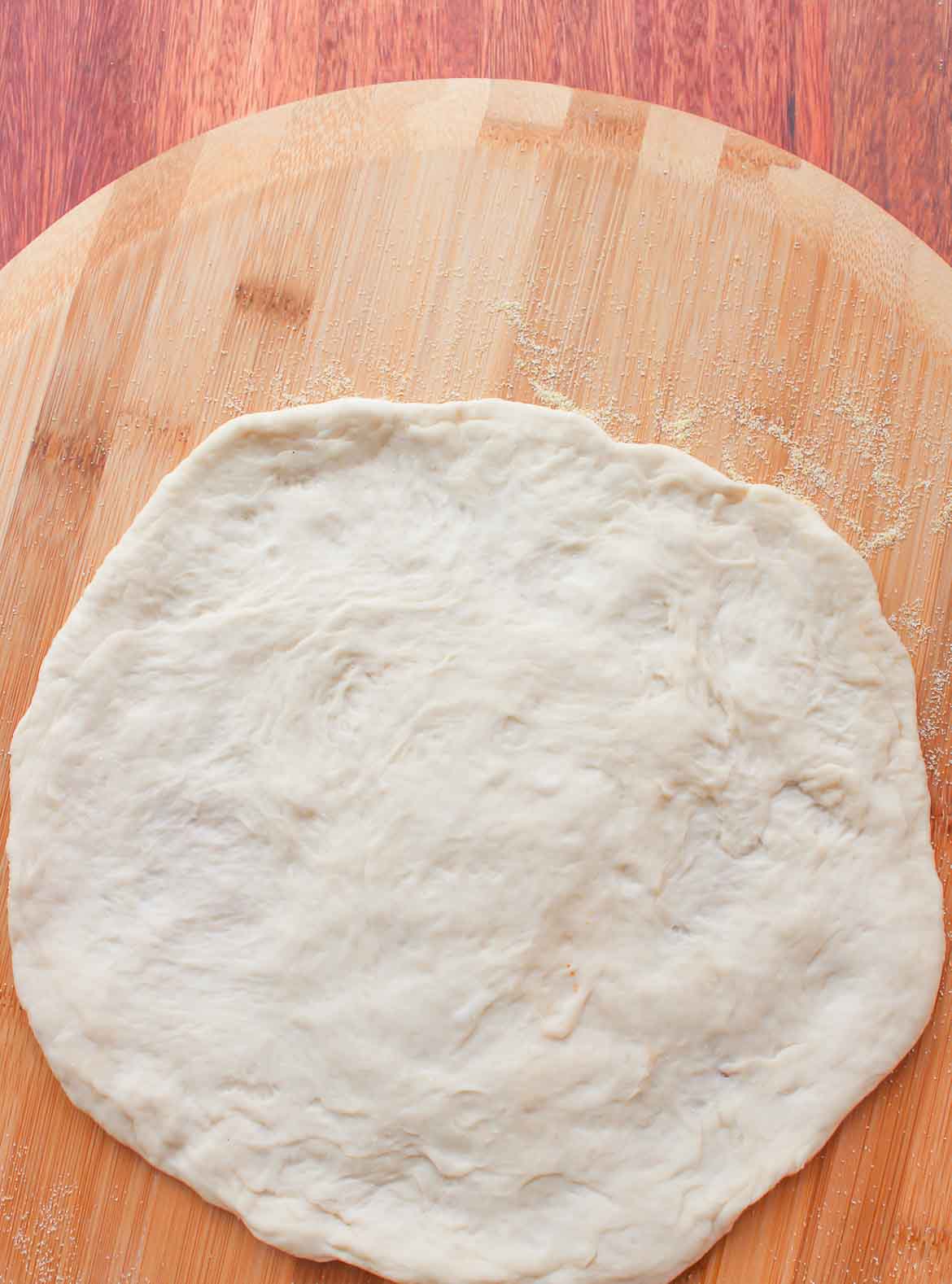 rustic pizza dough ready for toppings