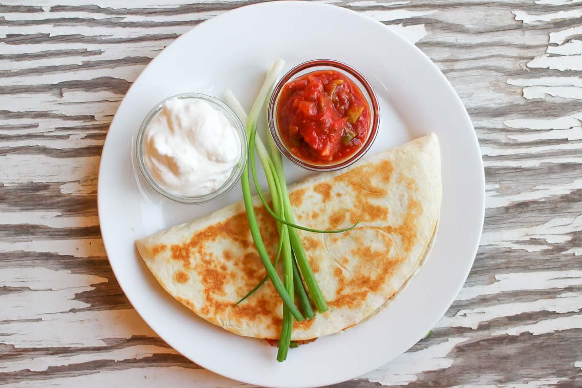 easy tofu quesadilla served with sour cream and salsa