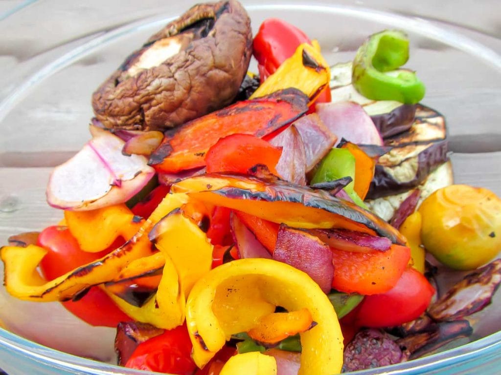 grilled mixed vegetables grilled in basket with bell peppers, onion, garlic, portabella mushroom and eggplant.