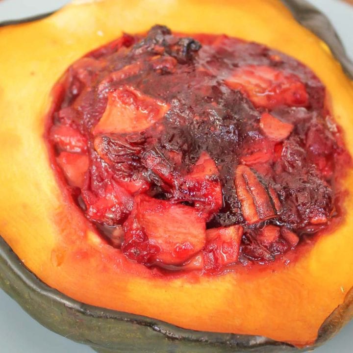 pan roasted acorn squash stuffed with apples cranberries and pecans