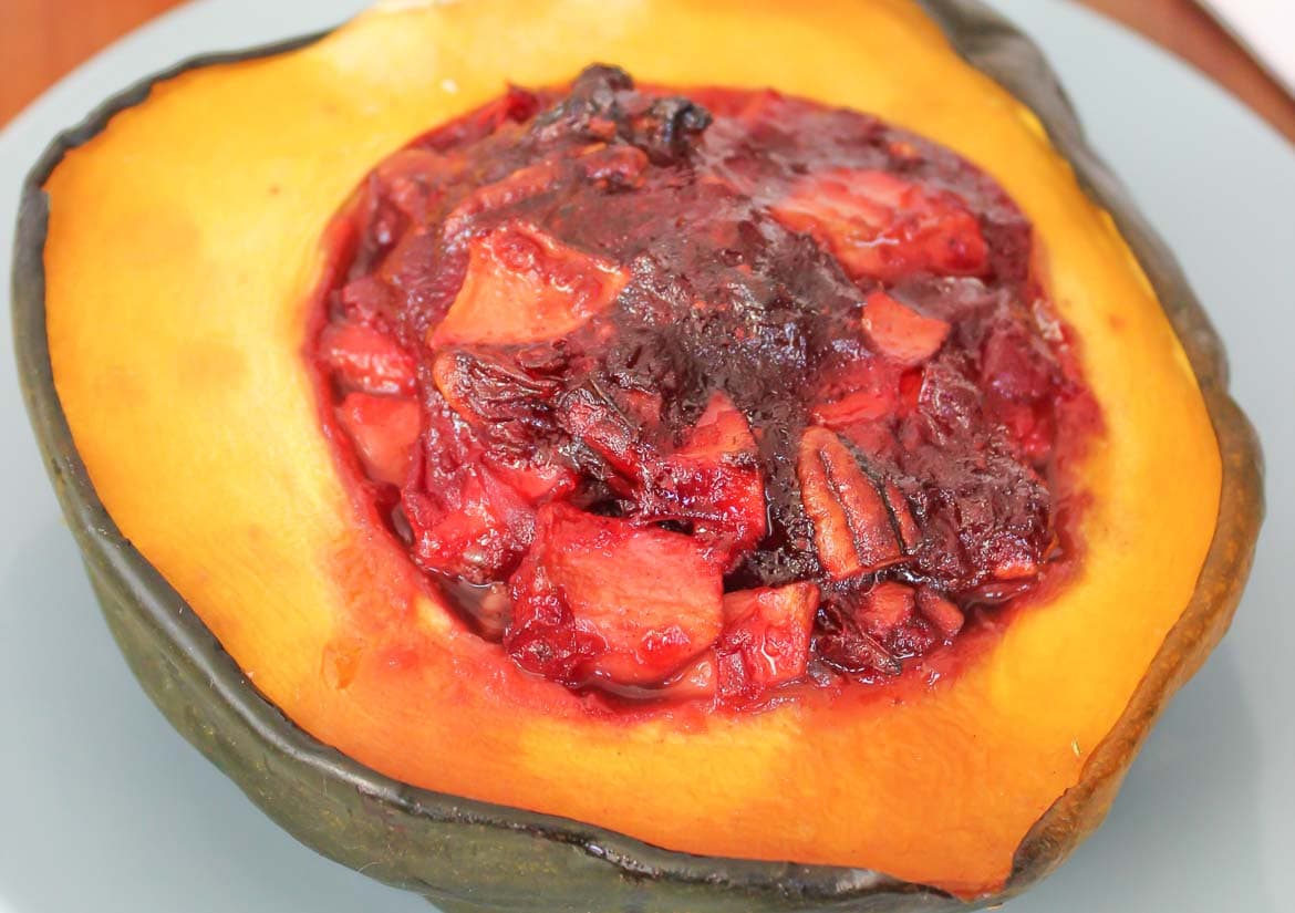 pan roasted acorn squash stuffed with apples cranberries and pecans