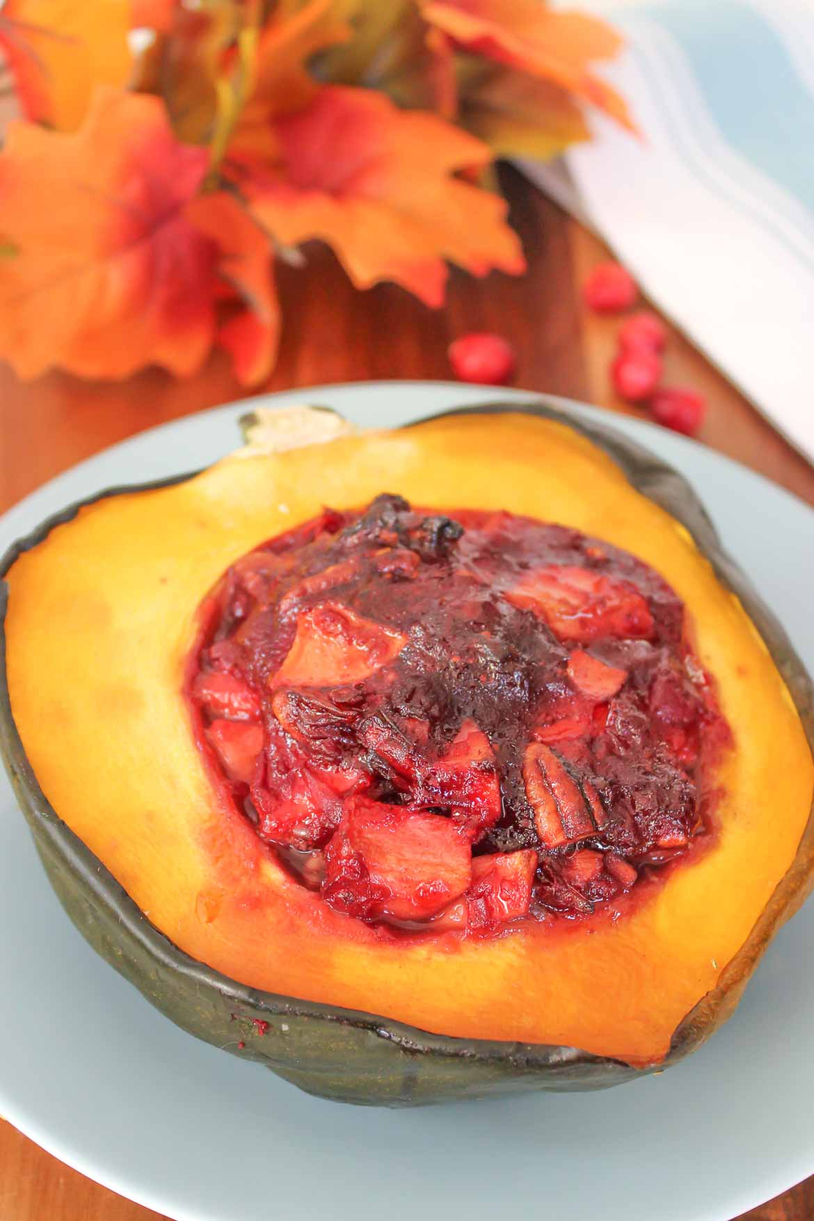 pan roasted acorn squash stuffed with apples cranberries and pecans