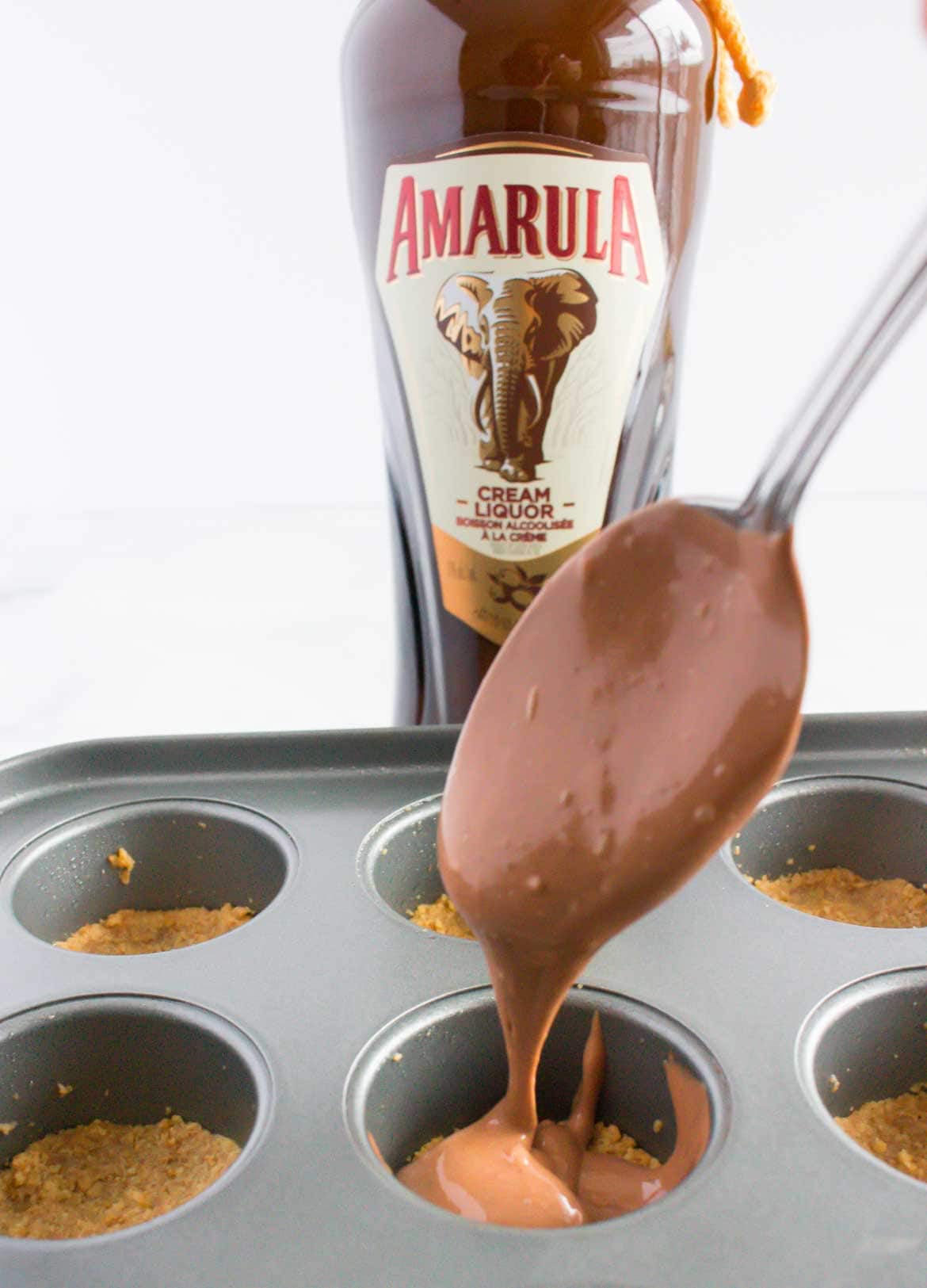 adding filling to mini chocolate cheesecake bites