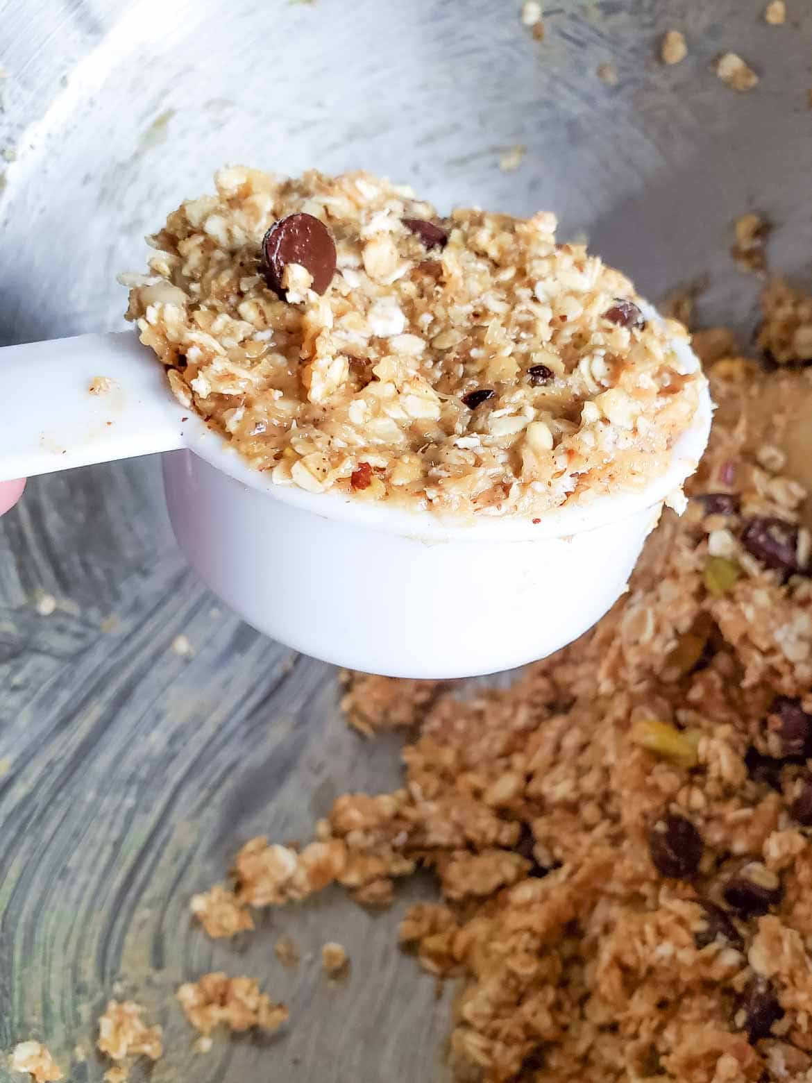 forming cookies in 1/4 cup size before baking batter for Banana Oatmeal Breakfast Cookie