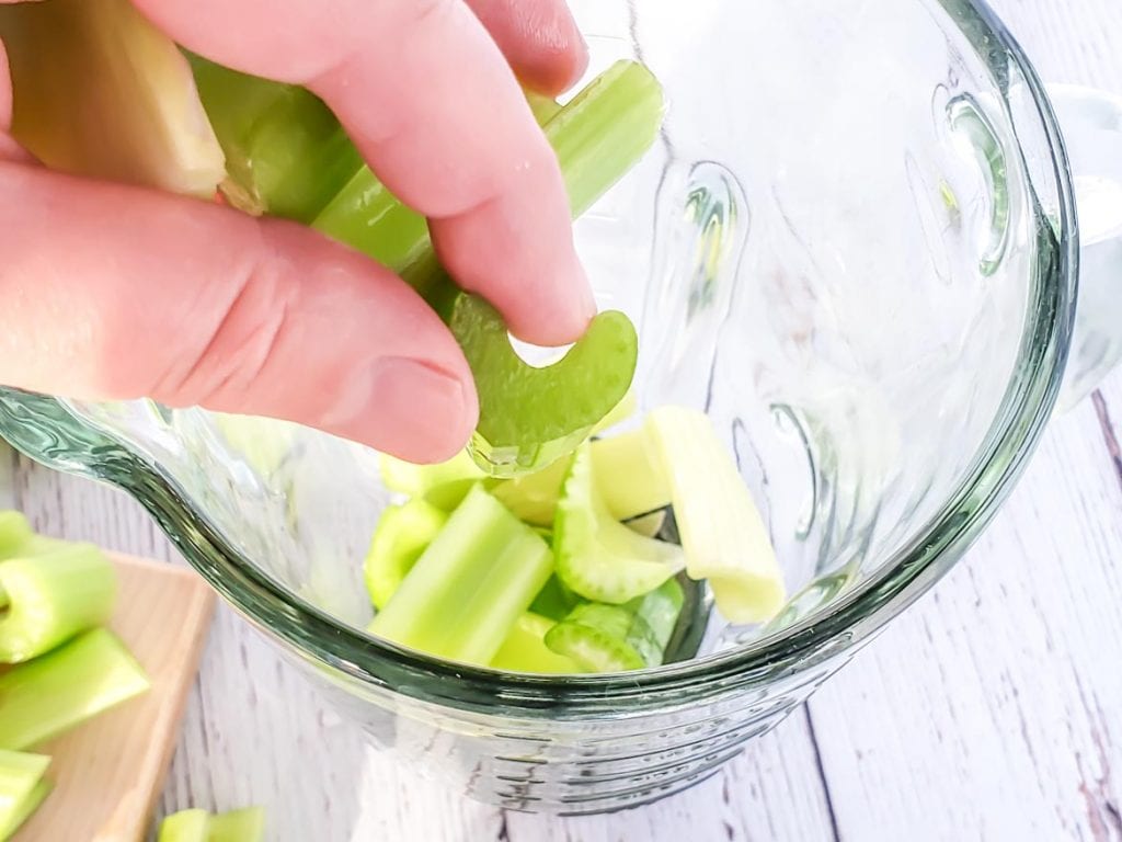 putting celery in a blender