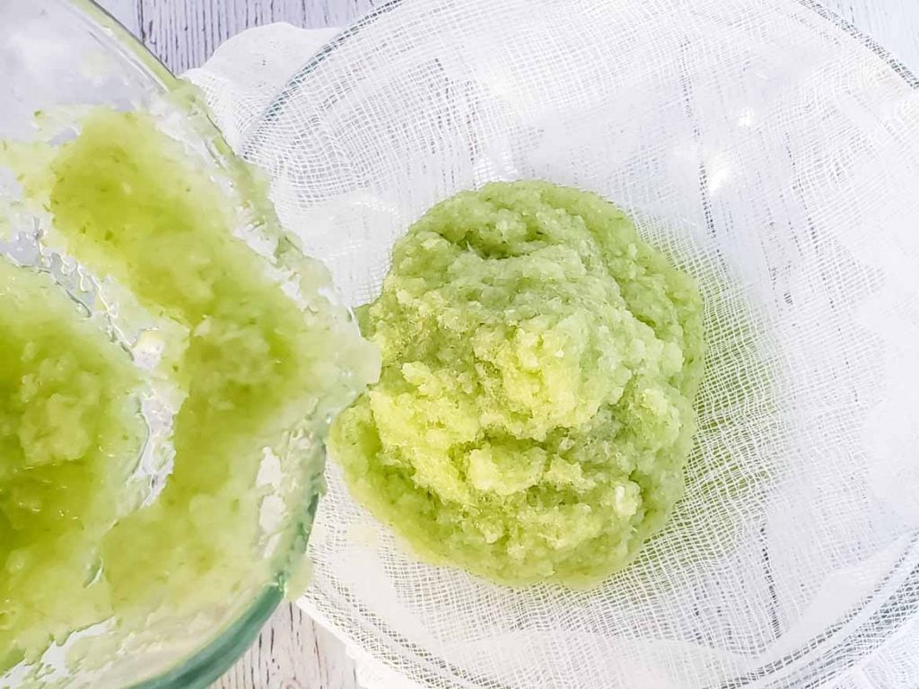 straining celery juice