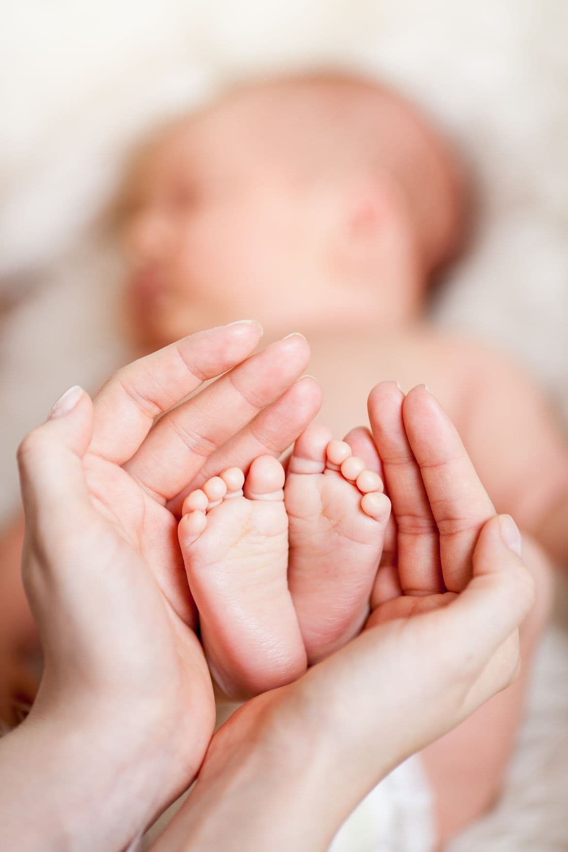 adorable baby feet in a gender neutral nursery