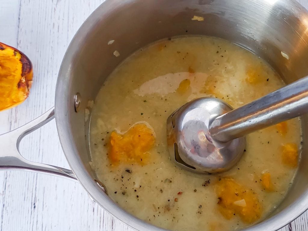 pureeing soup with an immersion blender