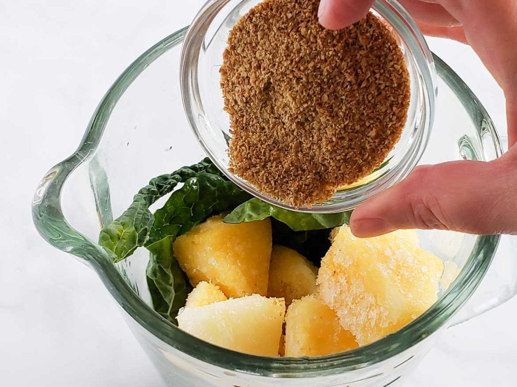 Making a Lacinato Kale smoothie in blender with pineapple