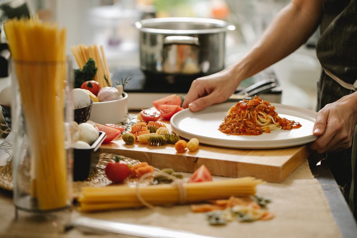 Making spaghetti in the kitchen