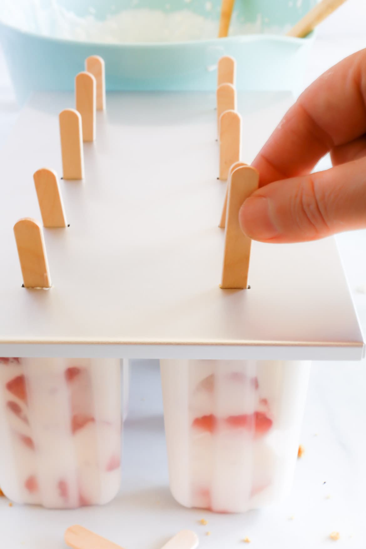 Strawberry cheese cake pops ready to go in the freezer