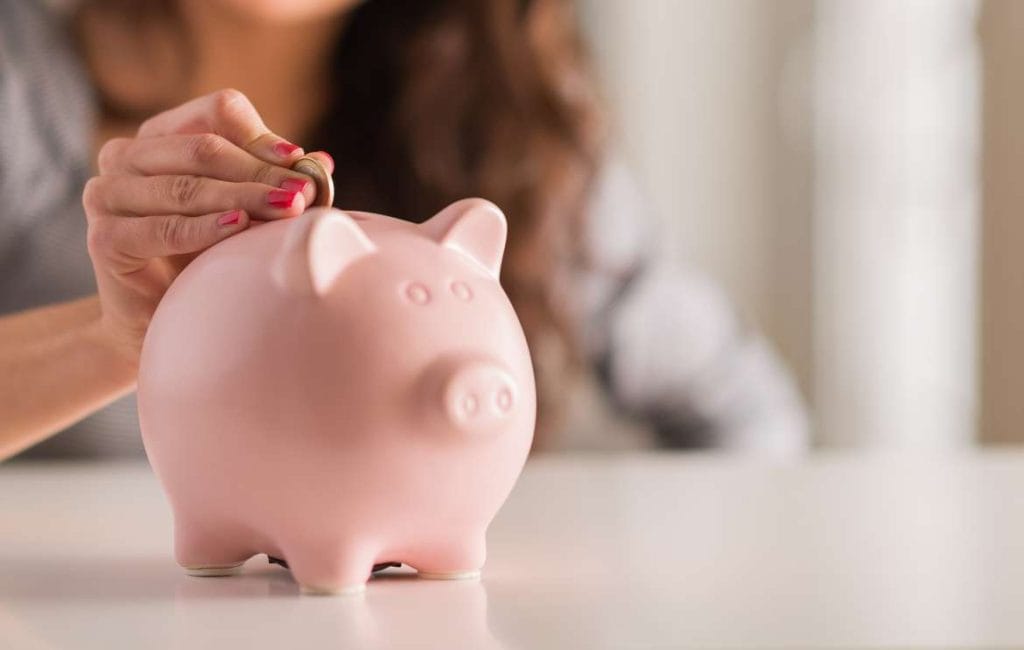 saving money in a piggy bank