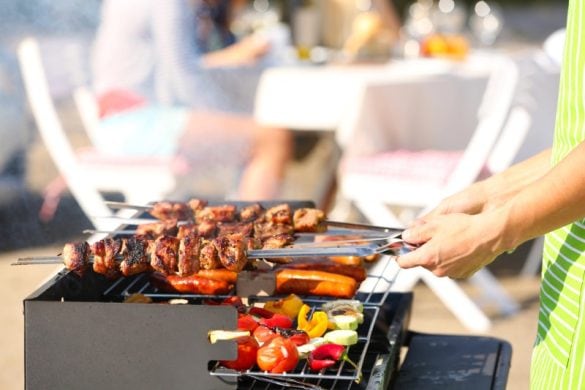 BBQ grill with people at a party
