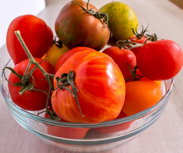 beautiful farm fresh tomatoes in a glass bowl