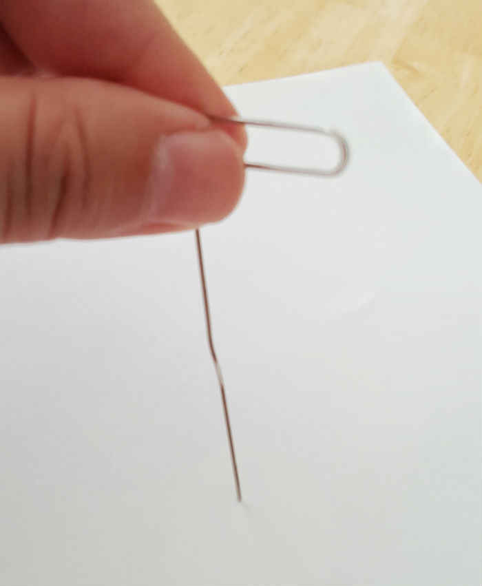 Netflix spinner paperclip poke hole in paper