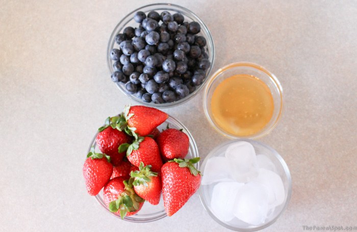 Strawberries blueberries ice and honey for Summer Berry Burst Silk Almond Smoothie