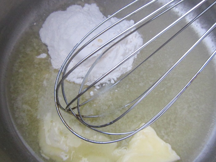 Adding the flour to the roux for Quinoa Macaroni and Cheese