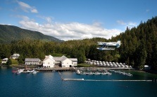Oceanfront shot of Waterfall Resort with a seaplane landing